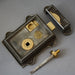 Iron Regency style rim latch with brass door handles