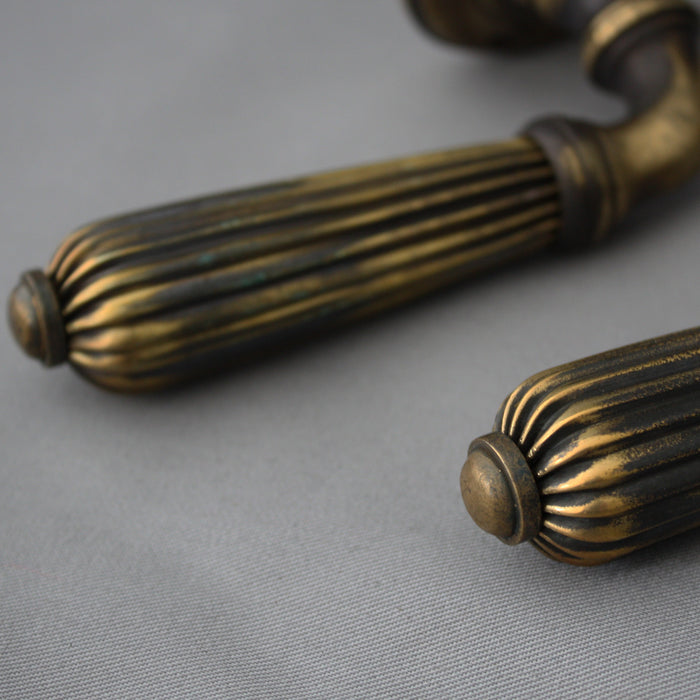 Reeded lever brass handles